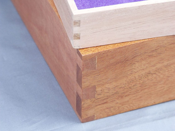 A close-up of the dovetailed corners on the box and on the sliding insert that goes on the inside of the box.