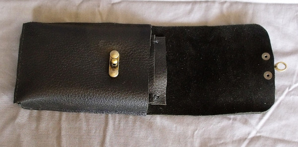 The leather phone holster with the flap open.  Two of the card slots are visible.