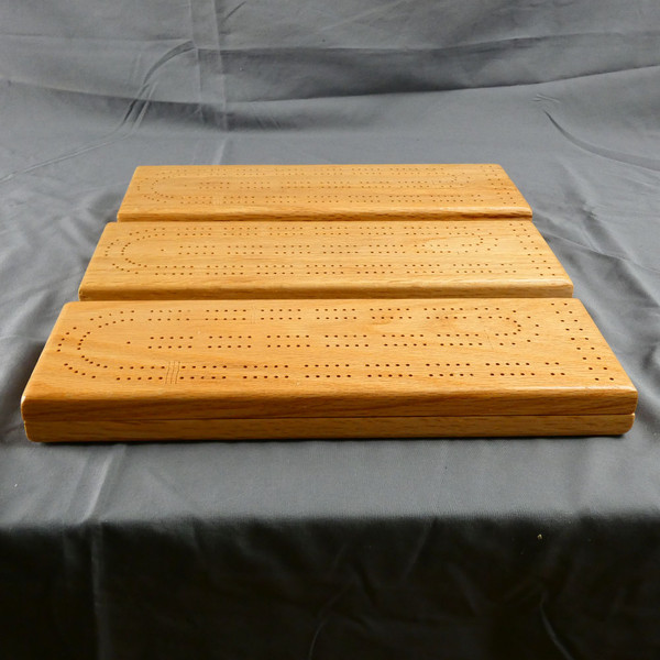 Three Red Oak 2 Player Cribbage Board showing the natural variation in the wood.