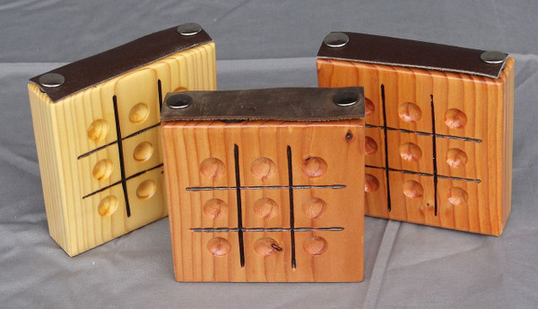 Three Tic Tac Toe games showing the natural variation in the wood.