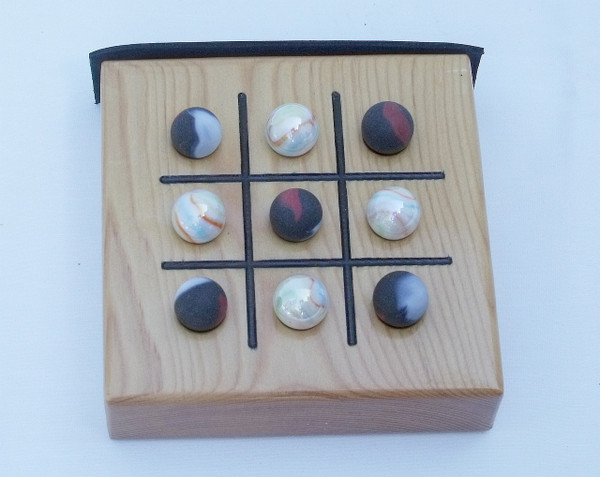 The Tic Tac Toe game with the marbles.