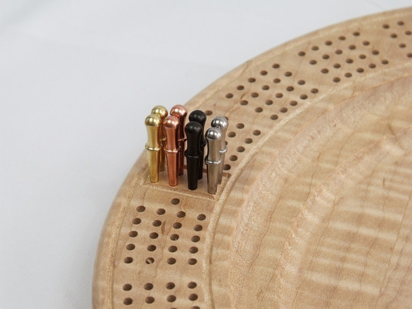 A close-up of the pegs in their starting positions on the board.