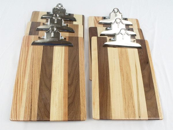 A group of six clipboards in a line showing the different variations between the boards.