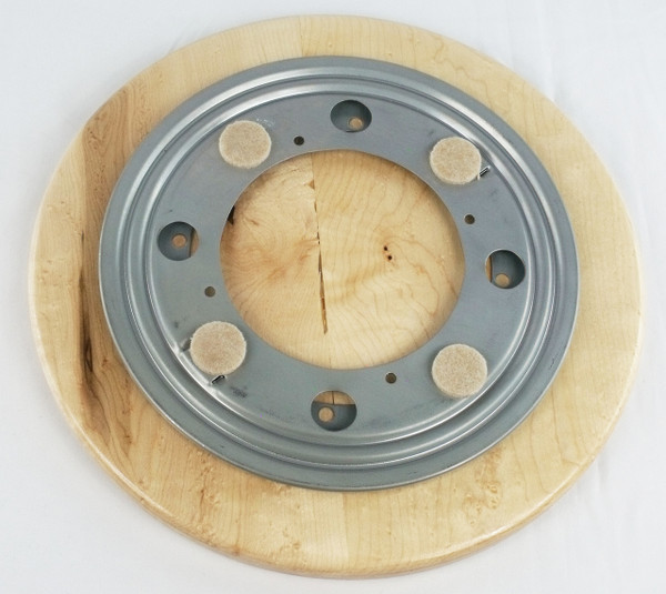 Bottom of the lazy susan showing the bearing with the felt pads.