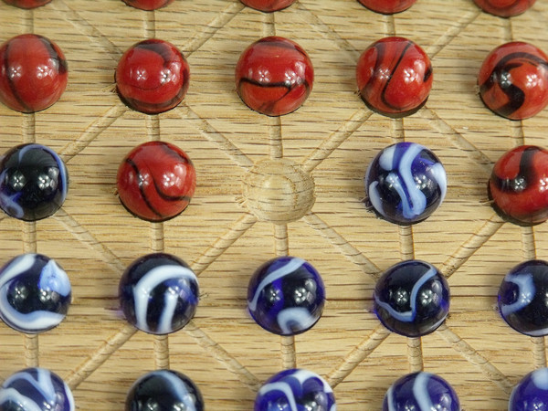 Close-up of the marbles on the Fanarona board.