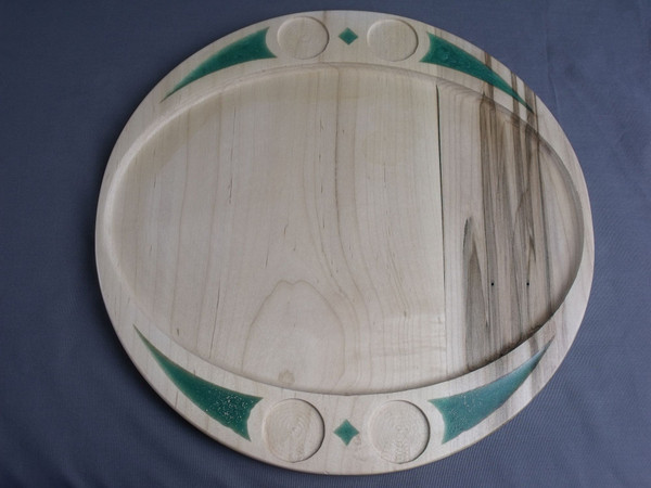 Front view of the ambrosia maple serving tray with green resin.