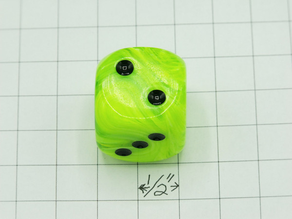 One 30mm die on graph paper to show scale.