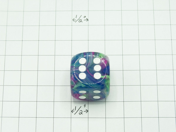 One 30mm die on graph paper to show scale.