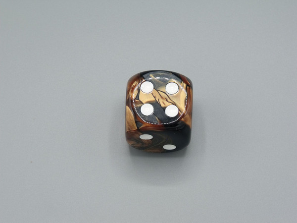 One 30mm Gemini Black-Copper die with white pips.