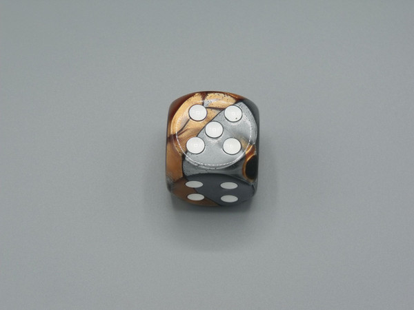 One 30mm Gemini Copper-Steel die with white pips.
