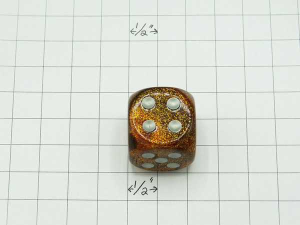 One 30mm die on graph paper to show scale.