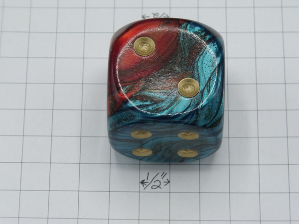 Another side of the 50mm Gemini Red-Teal die with Gold Pips.