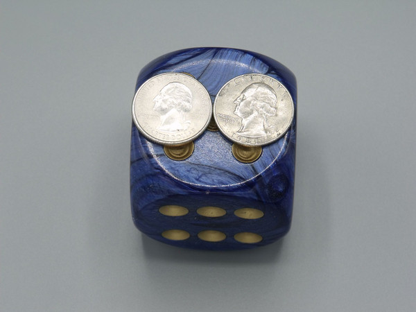 50mm Dice Scarab Royal Blue with Gold Pips with two quarters, side-by-side, on top of the die to show size.
