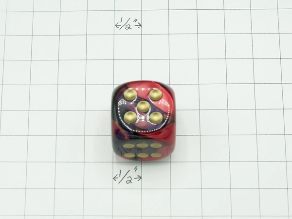 One 30mm die on graph paper to show scale.