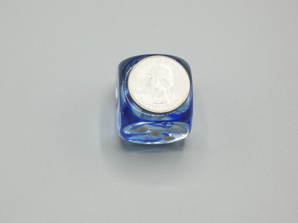 One 30mm die with a quarter on top for scale.