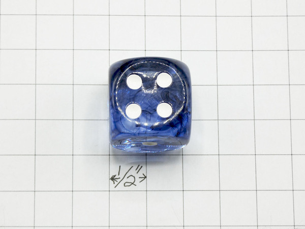 One 30mm die on graph paper to show scale.