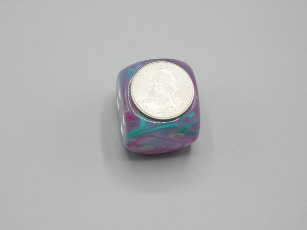 One 30mm die with a quarter on top for scale.
