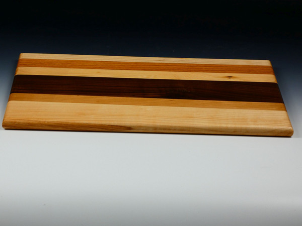 Side view of the multi-wood serving board #27 showing the thickness of the board.