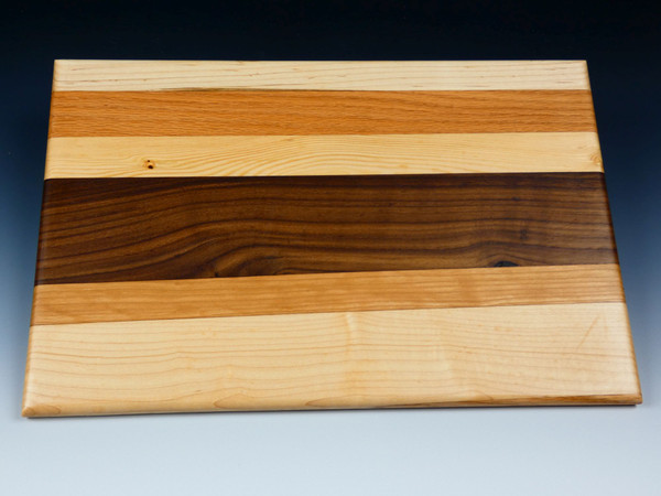Top view of the multi-wood serving board #27 showing the different woods the comprise the board.