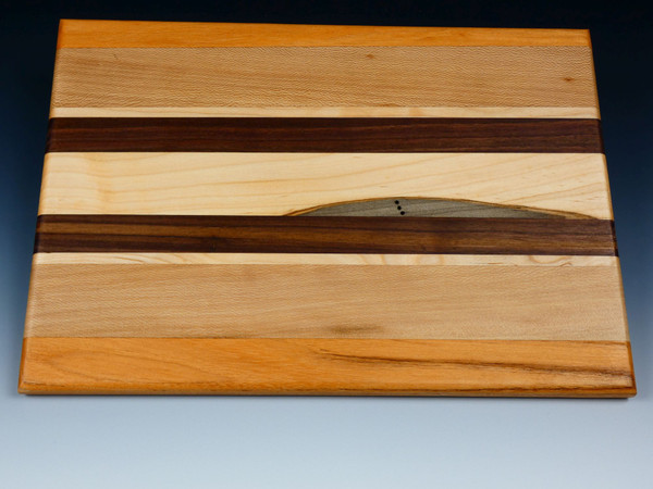 Top view of the multi-wood serving board showing the different woods.