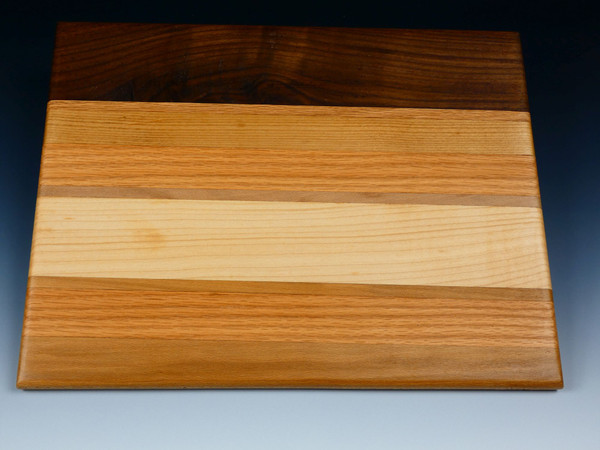 A serving or cutting board made up of several different woods.