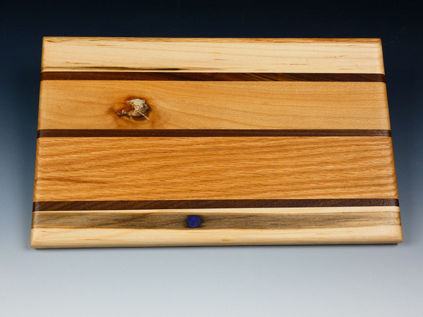 A top view of one side of the multi-wood serving board.
