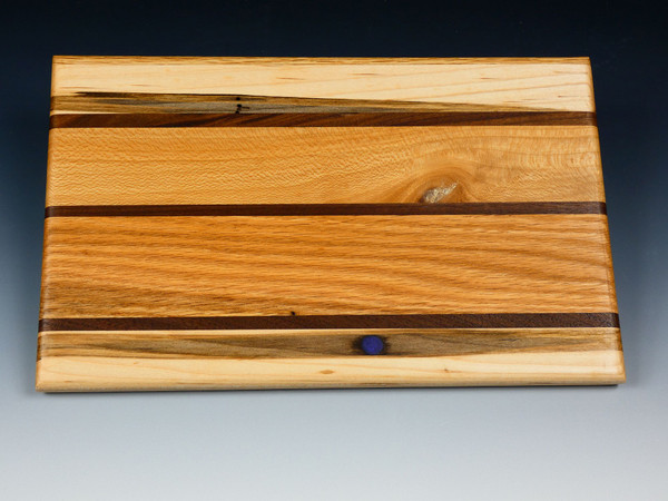 A top view of one side of the multi-wood serving board.