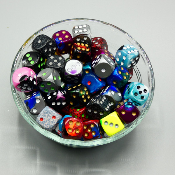 A bowl with a variety of 16mm d6 dice.
