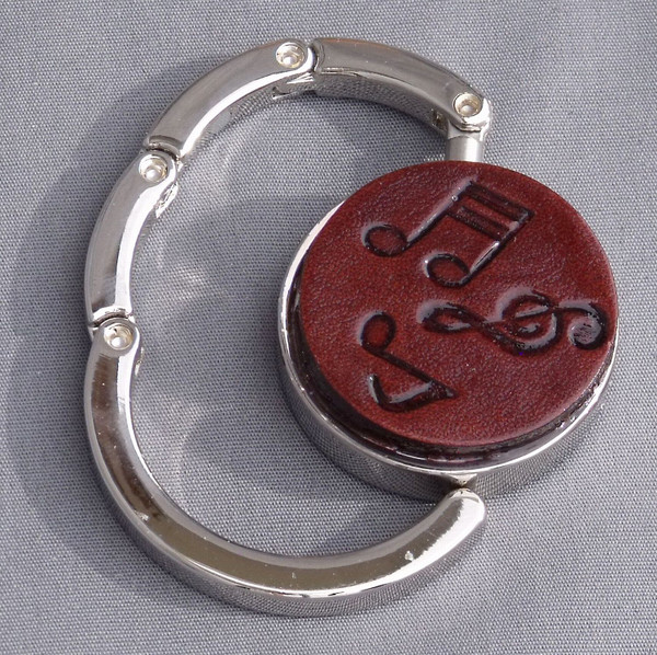 A purse hook that is partially open.