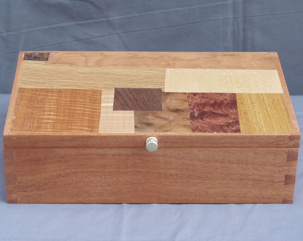The front and top of the mahogany mosaic valet box.
