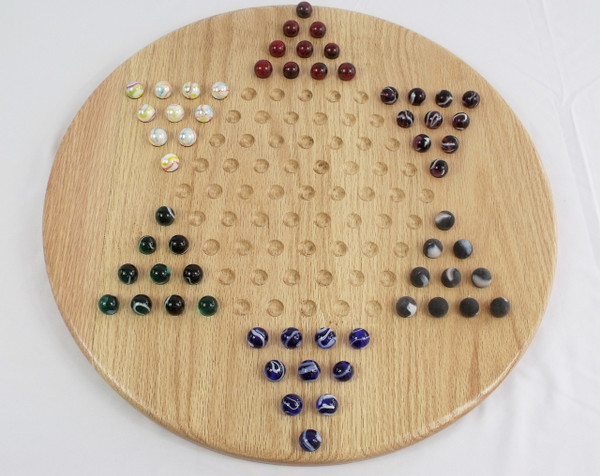 Wooden Chinese Checkers game in oak with the marbles in their starting position.
