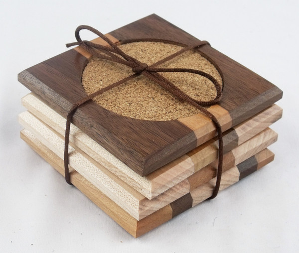 Set of 4 square reclaimed wood coasters in a mix of natural hardwood colors. No two coasters are the same.  This is an example of the coasters.  The actual product you receive will differ.