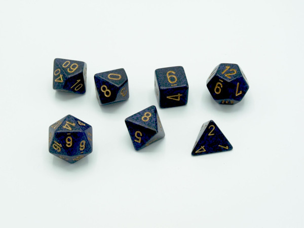 Polyhedral 7 die set of the Speckled Golden Cobalt line.  The dice have a deep blue base with black speckles and gold numbers.