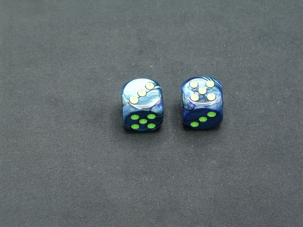 Two 16mm d6 Lustrous Dark Blue dice with green pips.
