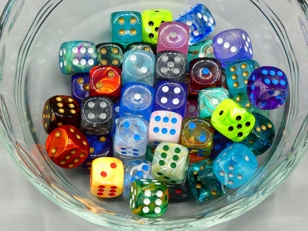 A bowl of 12mm multicolored dice.