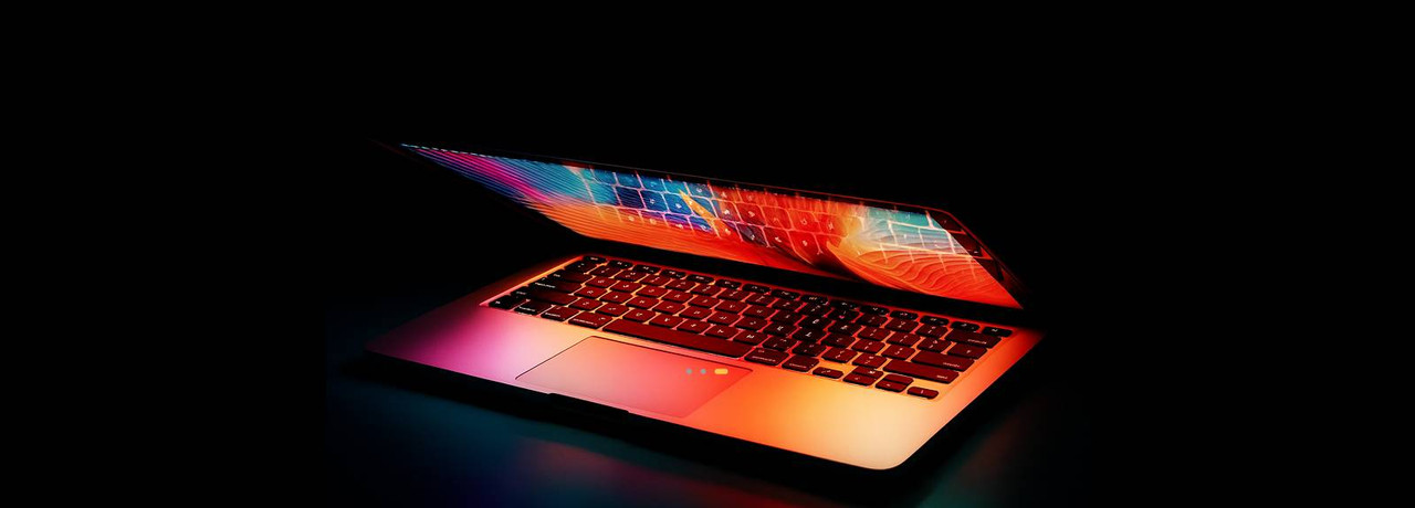 Laptop partially closed on desk