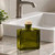 19.5mm Bar Top Cork - Full Synthetic Natural with Vintage Green Rectangular Bottle on Bathroom Counter by Sink