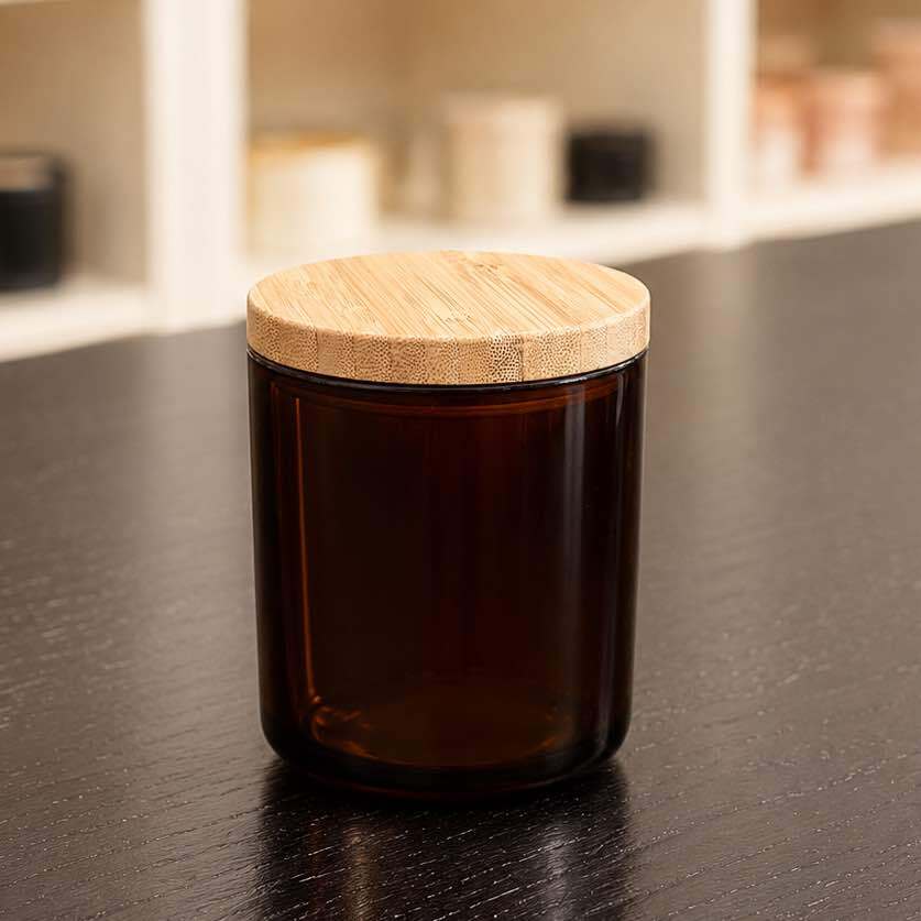 Neo 10 Natural Bamboo Lid 82mm on 8.5 oz Heavy Glass Container Dark Amber (7554G48) — full product view showing warm bamboo finish and elevated packaging presentation