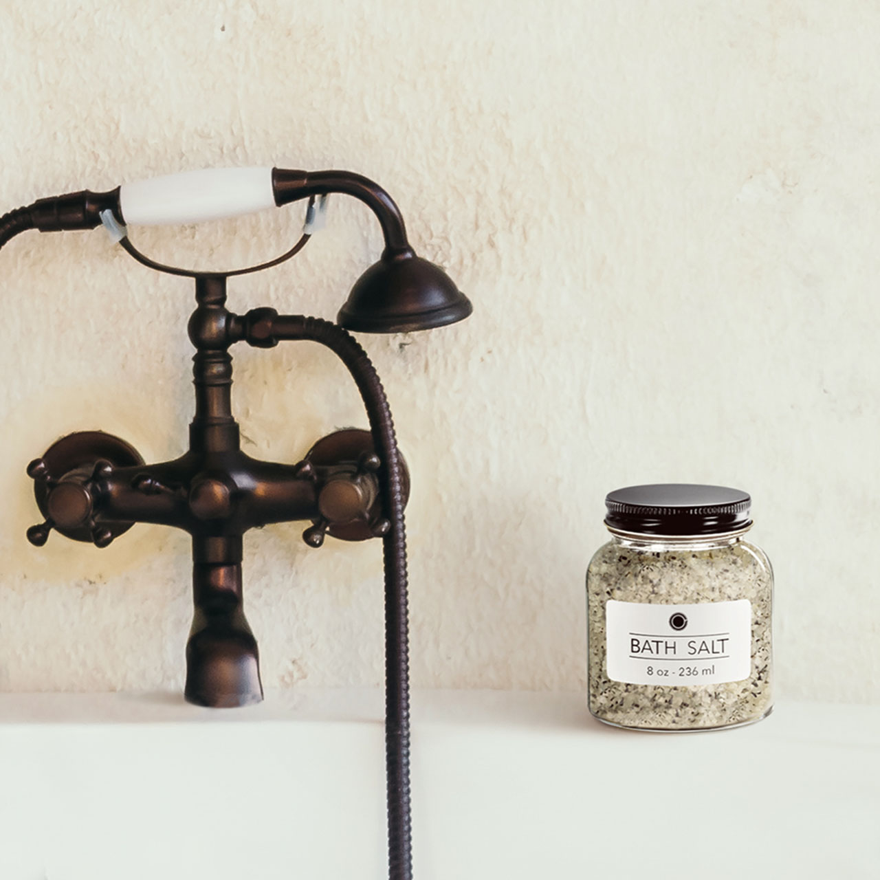 Bath salt jar on the side of a bathtub