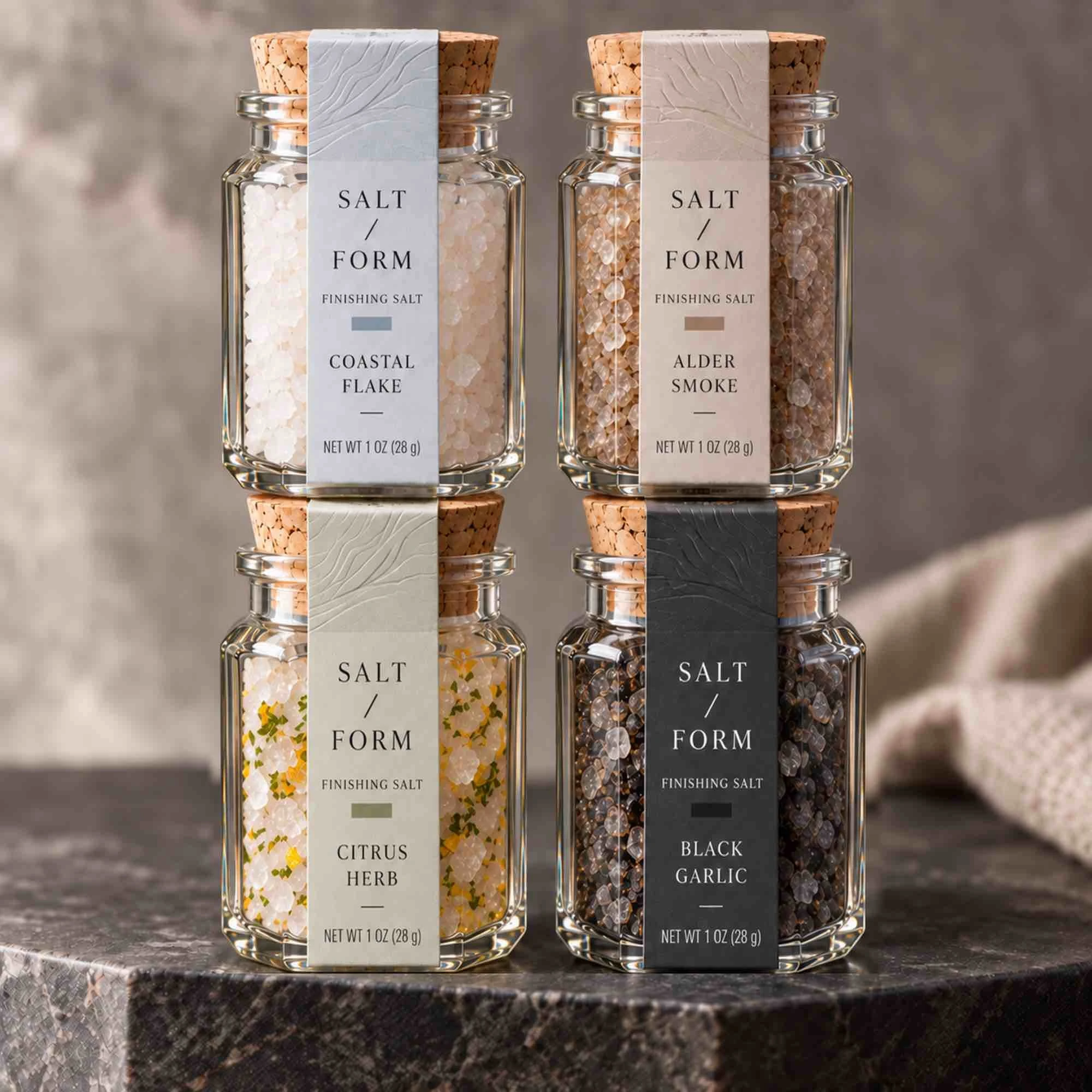 Specialty salts in 1.2 oz octagonal glass jars with cork closures