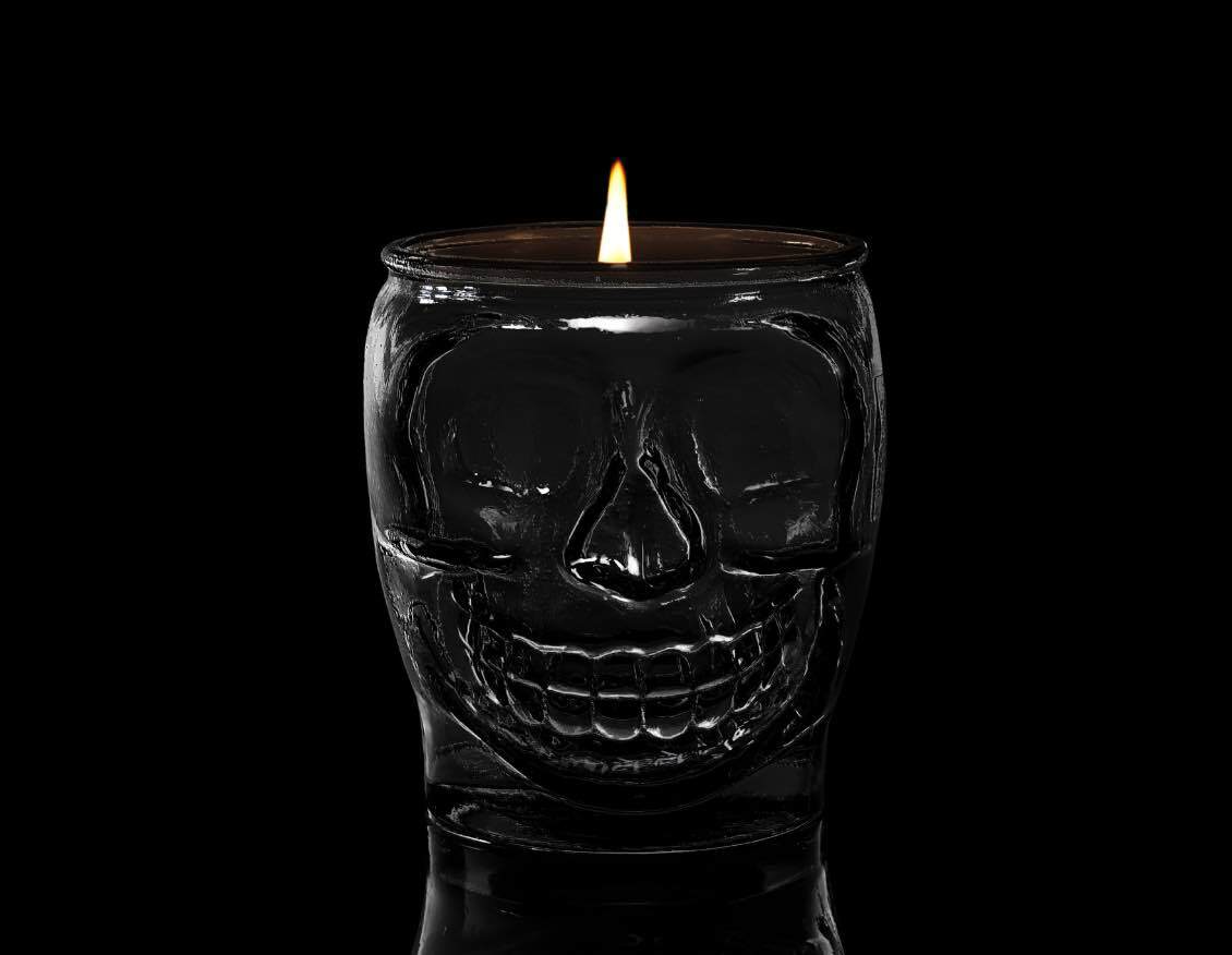 100% recycled skull-shaped glass candle container