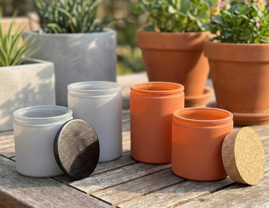 Calypso candle jars in Terracotta and Earth Grey finishes