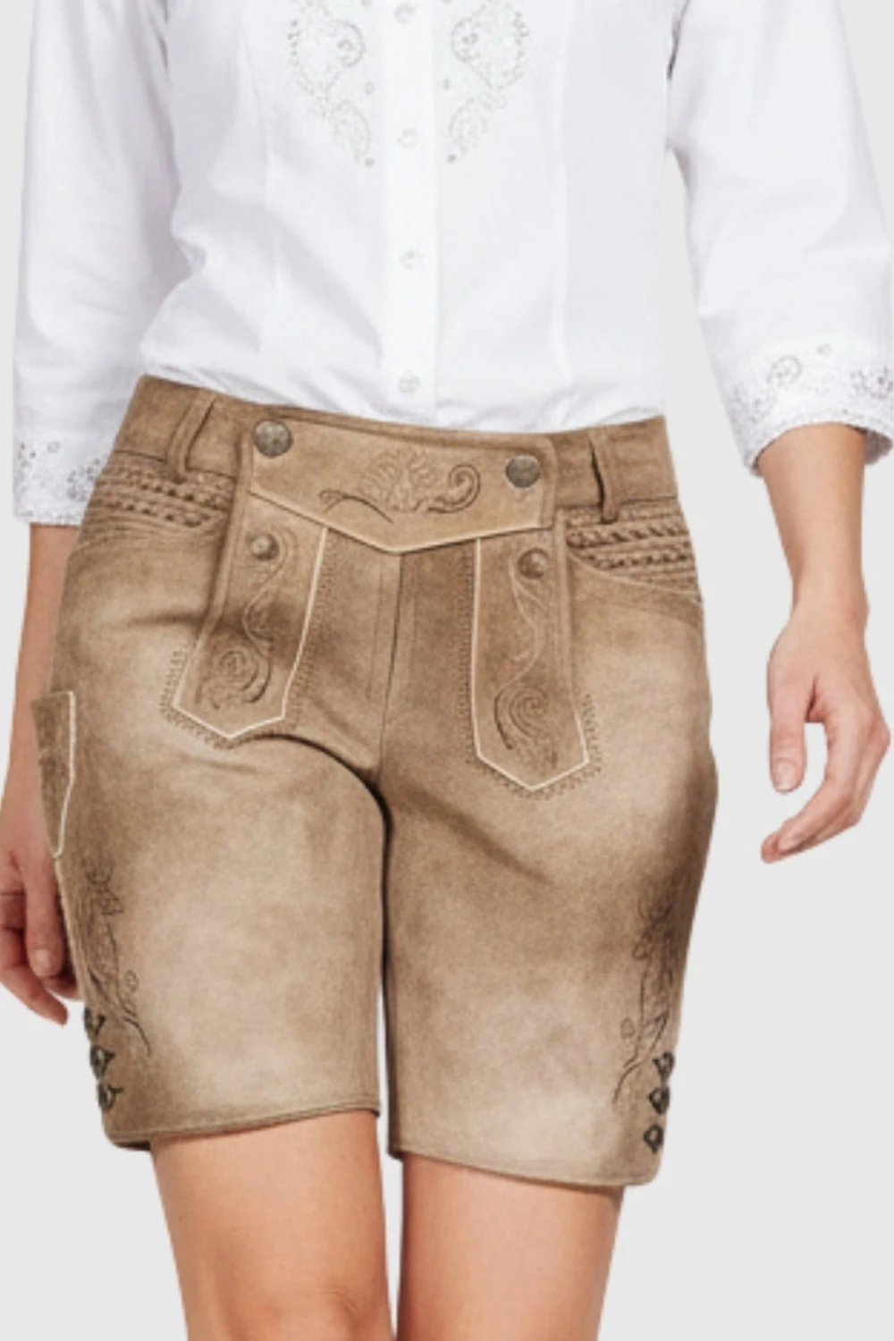 Brown denim shorts worn with a white shirt on a plain background