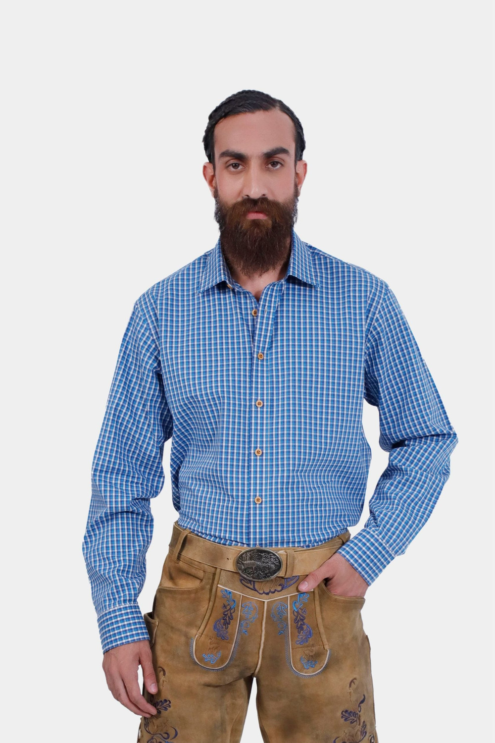 The image features a man wearing the Traditional Rilke Shirt, a blue and white checkered long-sleeve shirt paired with light brown embroidered Lederhosen. This classic Bavarian outfit is ideal for Oktoberfest.
