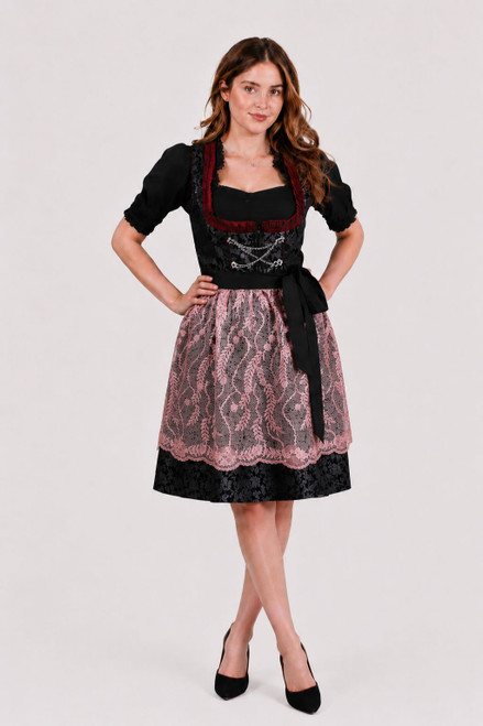 Mini dirndl Peri Baumeister by eLederhosen in Venetian Ruby with black Mieder, rose lace apron, and silver Charivari chain, front view