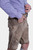Side view of a man wearing Traditional Bavarian lederhosen, featuring intricate embroidery and front flap pockets, perfect for Oktoberfest celebrations and cultural events