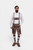 Complete front view of a man wearing Timber Trail Lederhosen in Caramel Earth with suspenders in natural embroidery, goat suede leather, and multiple pockets.