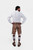 Back view of a man wearing Timber Trail Lederhosen in Caramel Earth with natural embroidery, goat suede leather, and multiple pockets.