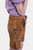 Side view of a model in brown leather lederhosen shorts with white embroidery, showcasing the side pocket and button detailing, paired with a purple checkered blouse