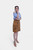 Model in Rustic Dream Lederhosen Skirt, Sunset Bronze goat suede, with blue gingham top.